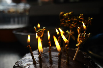 Birthday Cake with Glowing Candles in Dark Room Celebrating Special Occasion