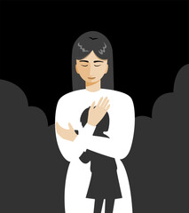 A woman standing and hugging herself while tapping, as if she talking to her inner child.