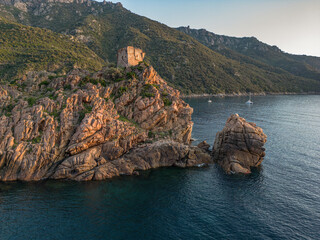 Aerial view town ruins Genoese tower of Porto Corsica France medieval watchtower Mediterranean Sea...