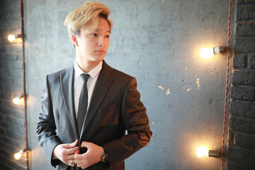 Young Asian businessman in white shirt and tie