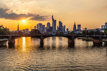 Fototapeta premium sunset at skyline of Frankfurt with river Main