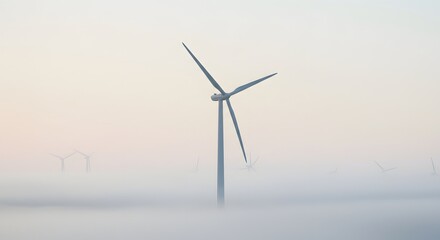 Obraz premium Wind turbine stands tall amidst a thick fog, with other turbines faintly visible in the background.
