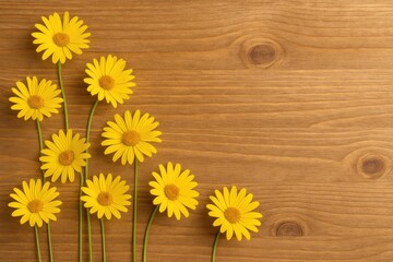 Obraz premium Golden blossoms displayed against a rustic wooden surface