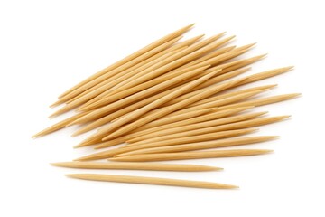 Single wooden toothpicks on a plain white backdrop