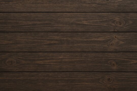 Vintage distressed dark wood flooring with continuous linear design, customizable space for text