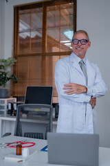Professional doctor in a modern office setting, wearing a white coat and glasses, standing with...