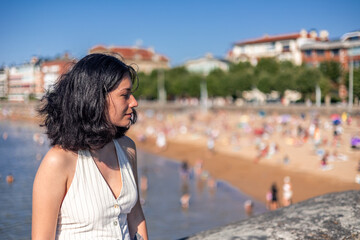 copyspace Young asian woman enjoying summer day near the beach in San Sebastian