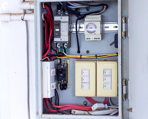 Electrical control panel with switches and circuit breakers, captured in sharp detail for...