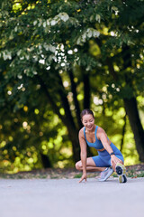 Woman Stretching Outdoors in Athletic Wear During a Sunny Day