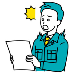 書類を見て驚く作業員の男性