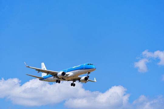 Passenger airplane KLM Cityhopper Embraer E190STD registration PH-EZN landing at Swiss Airport Z&uuml;rich Kloten on a sunny summer day. Photo taken July 12th, 2025, Zurich, Switzerland.