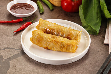 Vietnamese stuffed spring roll served sauce