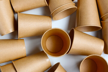 Brown paper cups on white background.