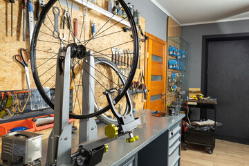 Bicycle wheel tuning station in workshop