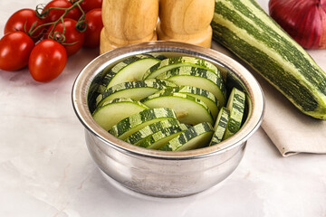 Raw green zucchini slices for cooking
