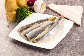 Marinated salted herring fillet apetizer