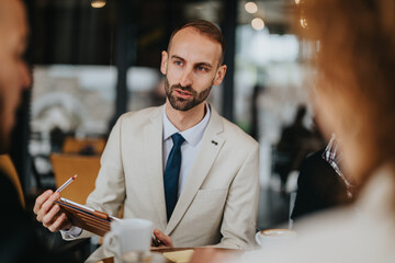 Group of professionals discussing business strategies in a casual outdoor setting while networking....