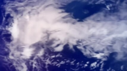 A stunning detailed view of Earth from space, showing continents and swirling clouds, then zooming out to reveal the full blue planet rotating beautifully