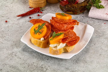 Bruschetta with sausage and tomato