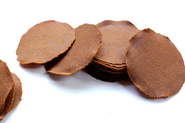Sun-dried fermented soybean sheets called “Thua Nao,” a traditional ingredient in Northern Thai...