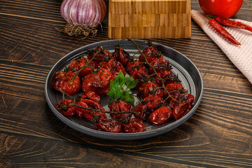 Baked cheeryy momatoes with olive oil