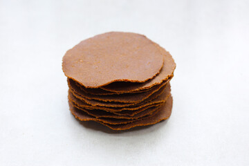 Fermented soybean discs, known as “Thua Nao,” a traditional Thai seasoning used to enhance flavor in Northern cuisine.