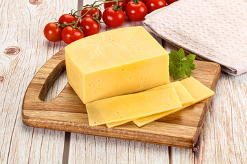 Yellow cheese piece with slices