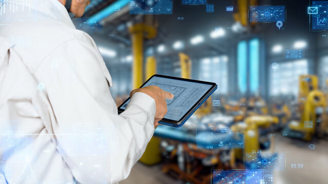 Digital network with engineers using tablets in factory