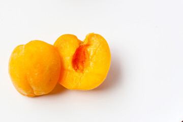 Fresh ripe apricots on a white background.