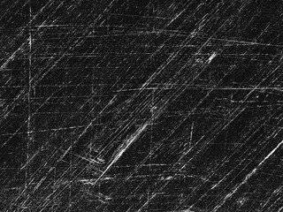 Textured surface showing scratches and marks on a black background, representing wear over time in a creative composition