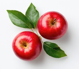 Two vibrant red apples with glossy skin and green leaves, arranged on a stark white background; overhead shot