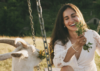Beautiful young model and a goat