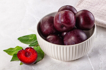 Raw ripe purple plum heap