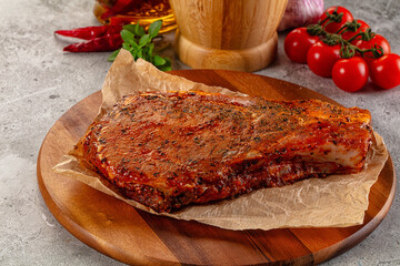 Raw marinated pork loin steak