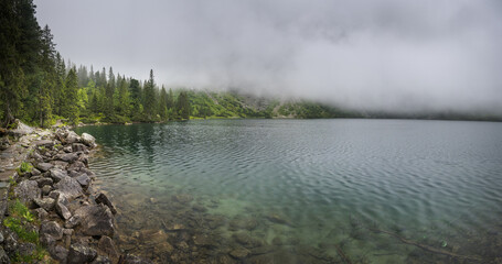 Mountain lake in the fog, mountain landscape.
