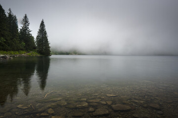 Mountain lake in the fog, mountain landscape.
