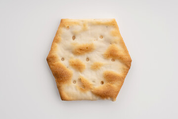 Whole grain crackers with spices and herbs isolated on white background. Dry salted cookies with crackers. Stack of various crispy wheat, rye and corn tortillas with sesame and sunflower seeds