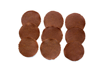 Fermented soybean discs, known as “Thua Nao,” a traditional Thai seasoning used to enhance...