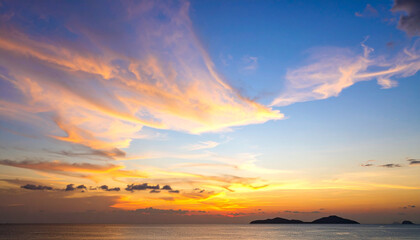 Sunset sky background in the evening with gradient natural light and dramatic cloud, long exposure
