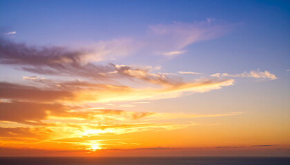 Sunset sky background in the evening with gradient natural light and dramatic cloud, long exposure
