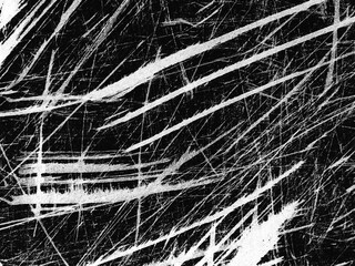 Texture of scratched surface reveals intricate patterns with high contrast in black and white colors