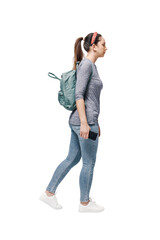 Young woman with a backpack on her shoulders walking.
