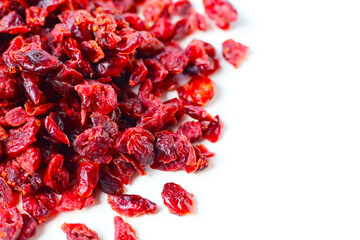 Dried cranberries piled on a white background