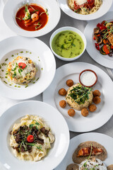 Many kinds of food on white plates