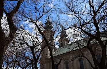 View through bare tree branches of the Catholic Cathedral of St. Theresa in Subojica