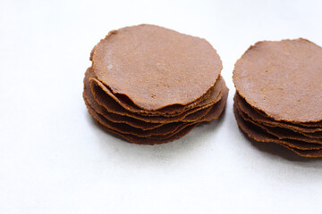 Sun-dried fermented soybean sheets called “Thua Nao,” a traditional ingredient in Northern Thai cooking.