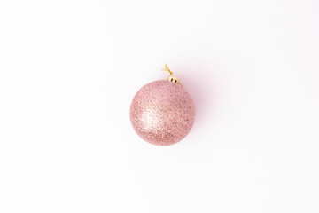 Pink Christmas ball ornament isolated on white background. Minimalist festive decoration. Ideal for holiday designs, greeting cards, and seasonal compositions.