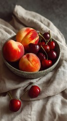 Freshly Picked Summer Fruits Featuring Ripe Peaches and Sweet Cherries