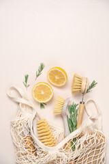 Zero waste home cleaning supplies, lemon and rosemary for making sustainable cleaning essentials on...