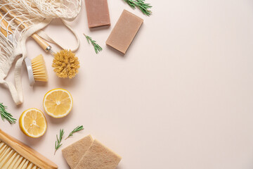 Zero waste home cleaning supplies, lemon and rosemary for making sustainable cleaning essentials on...